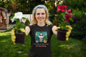 female wearing Them Fine People T-shirt and holding two flower pots