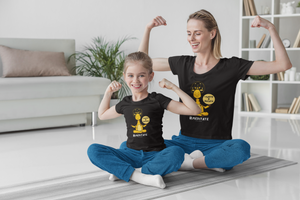 woman doing yoga with her daughter
